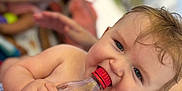 Eros joined the competition — help win amazing prizes! toddler, baby, bottle, soda, child, outdoor, summer, drink, cap, hand, skin, person, blurred_background, blue_eyes, hair, candid, playful, sunlight, water, family