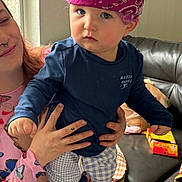Eros joined the competition — help win amazing prizes! toddler, child, adult, bandana, blue_shirt, checkered_shorts, tattoo, butterfly_clothing, indoor, leather_couch, hand, person, smile, face, foot, window, door, skin, hair, holding