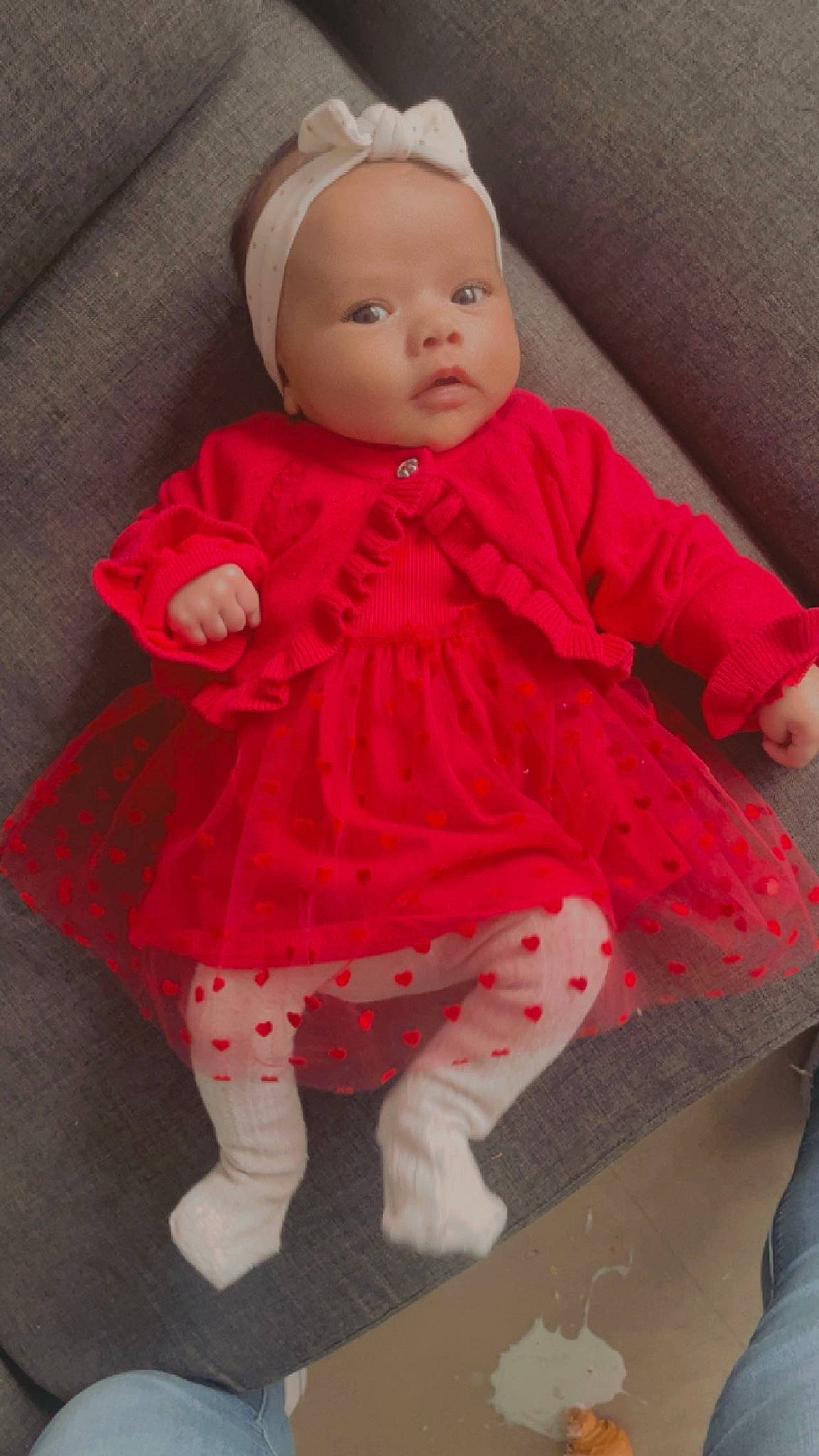 Giulia participe au concours pour gagner de l'argent avec cette photo : baby, baby_toddler_clothing, cheek, child, costume, dress, embellishment, flooring, linens, magenta, pattern, peach, person, pink, sitting, skin, sleeve, sock, textile, toddler