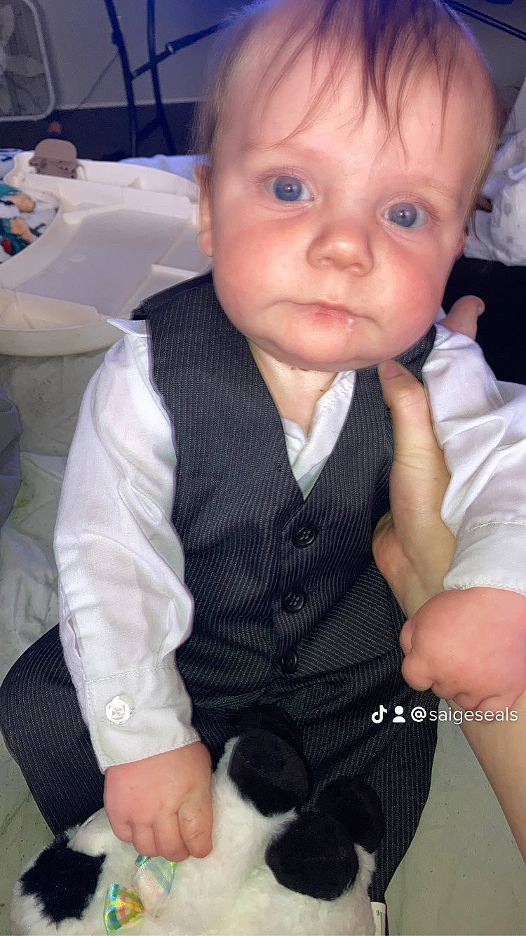 Charles is registered to the contest to win money with this photo: baby, baby_toddler_clothing, cheek, chin, dress_shirt, eye, eyebrow, eyelash, gesture, hair, happy, iris, lip, nail, nose, person, skin, sleeve, thumb, tie