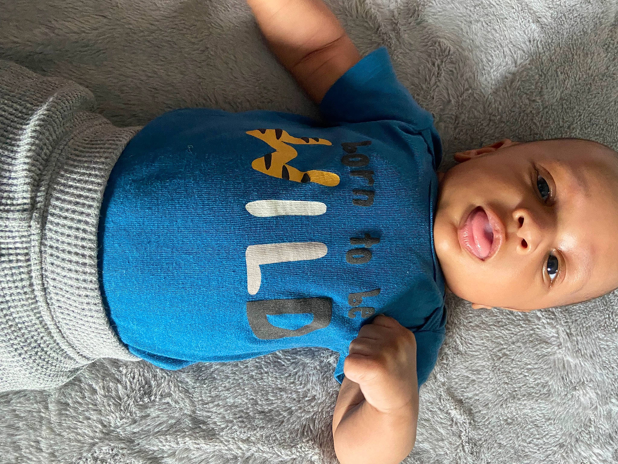 Jamier joined the competition — help win amazing prizes! azure, baby, baby_toddler_clothing, blue, comfort, eye, finger, grey, hand, headgear, human_body, mouth, organ, person, product, skin, sleeve, textile, thigh, toddler