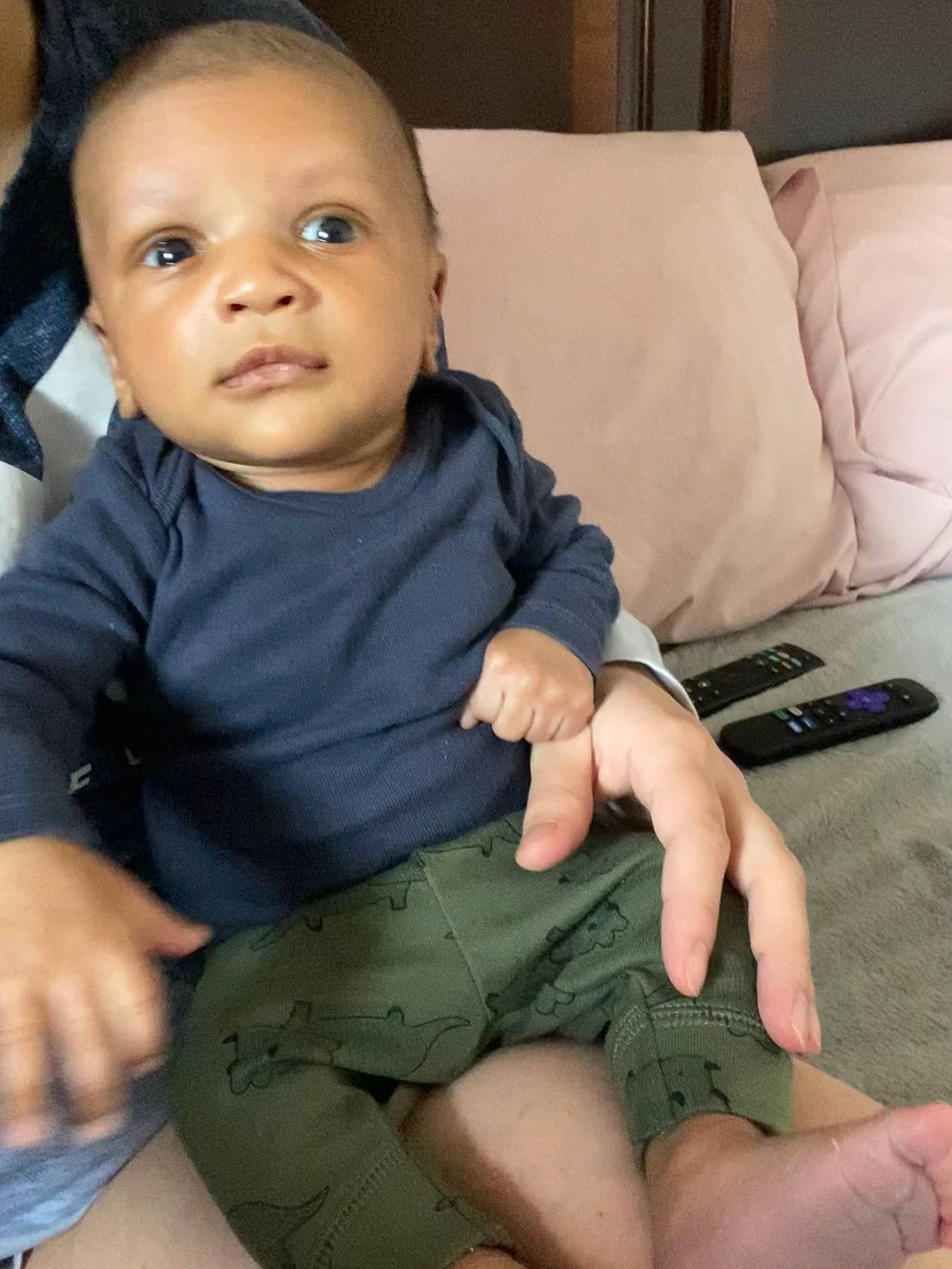 Jamier is registered to the contest to win money with this photo: baby_toddler_clothing, cheek, chin, comfort, eye, finger, gesture, hand, head, human_body, iris, joint, leg, mammal, mouth, neck, nose, person, shoulder, skin