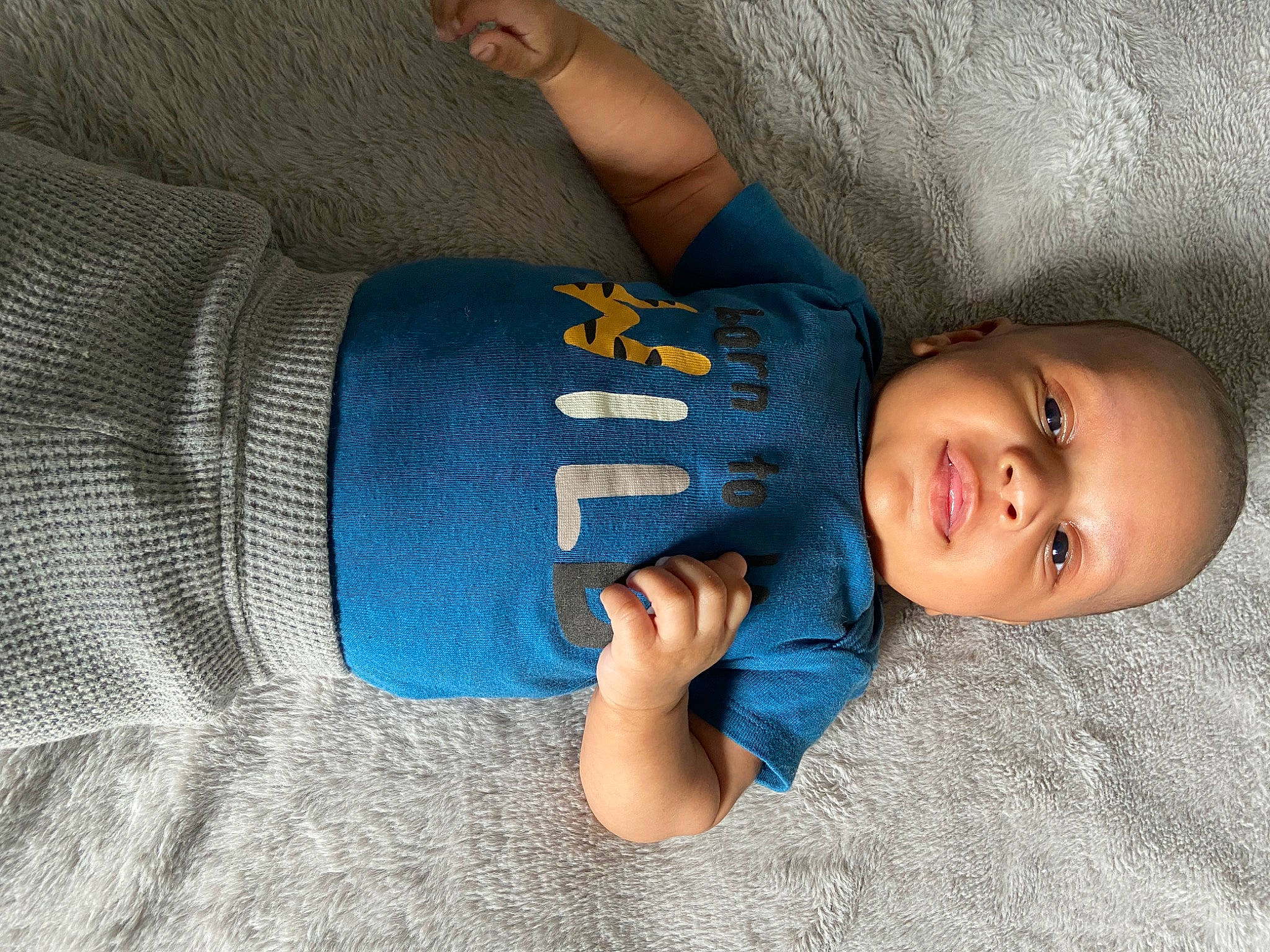 Jamier is registered to the contest to win money with this photo: azure, baby, baby_toddler_clothing, comfort, elbow, facial_expression, finger, grey, hand, head, headgear, human_body, knee, leg, mouth, person, product, skin, sleeve, textile