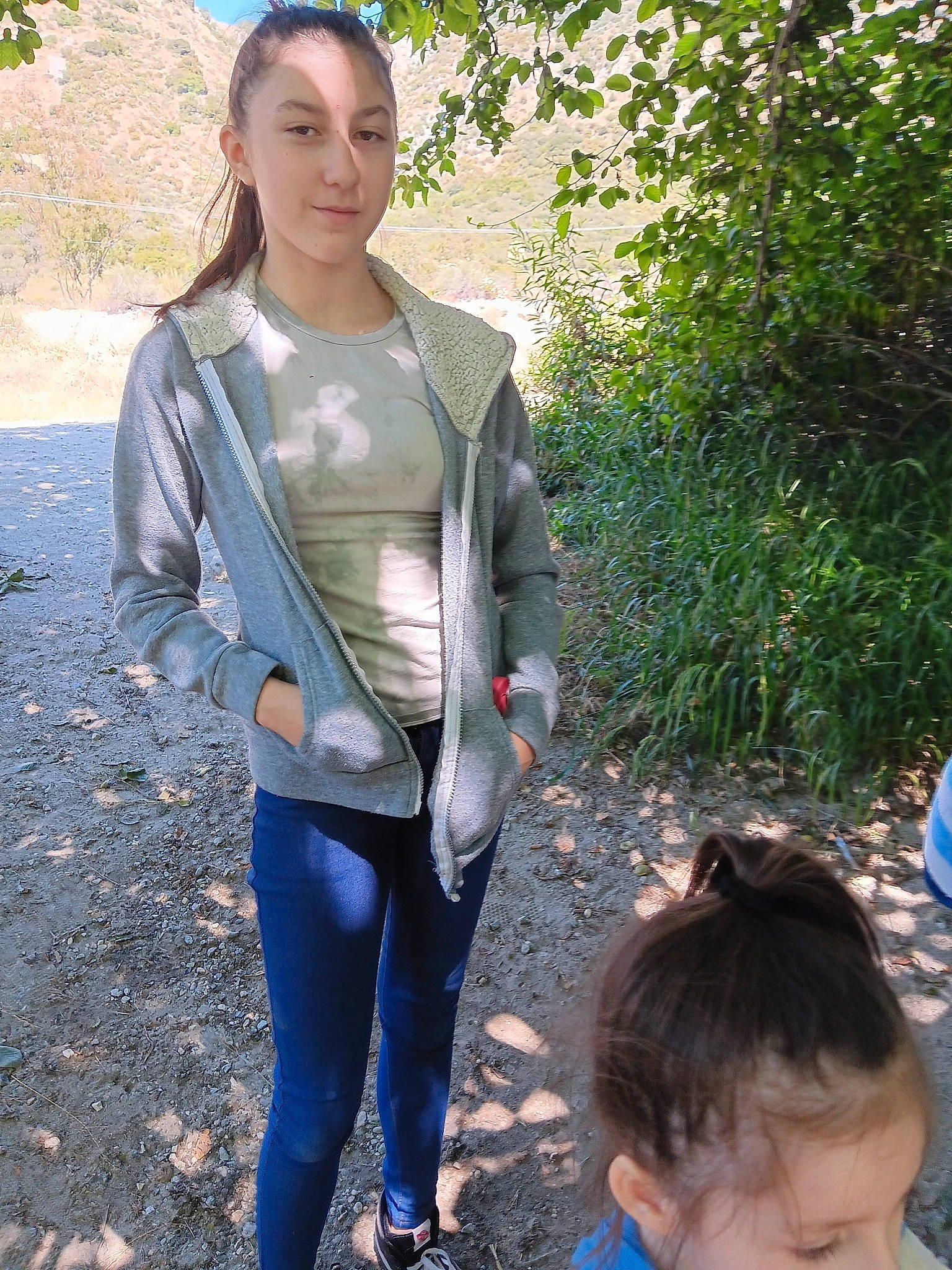 Alana Valdez is registered to the contest to win money with this photo: blue, chest, denim, electric_blue, eyewear, fashion_accessory, fun, grass, joy, leggings, leisure, person, personal_protective_equipment, photograph, plant, sleeve, spandex, sportswear, thigh, tree