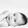 Ava participe au concours pour gagner de l'argent avec cette photo : adorable, baby, black_and_white, blanket, child, close_up, cute, expression, eyes, face, hands, infant, lying_down, monochrome, newborn, peaceful, portrait, resting, skin, soft