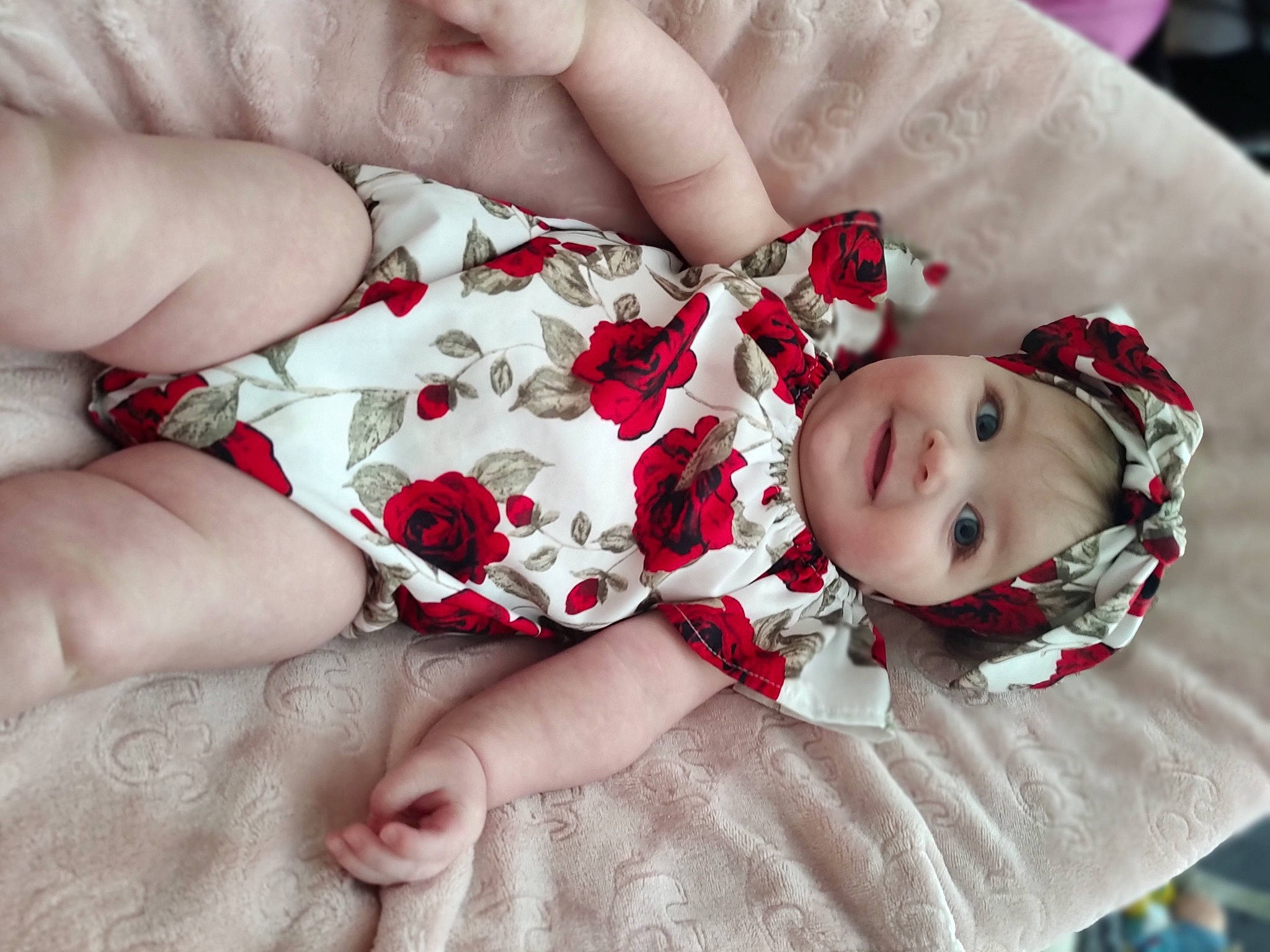 Claire joined the competition — help win amazing prizes! baby, baby_toddler_clothing, child, comfort, dress, finger, foot, happy, headwear, human_leg, joy, lip, nail, pattern, person, pink, red, skin, sleeve, thigh