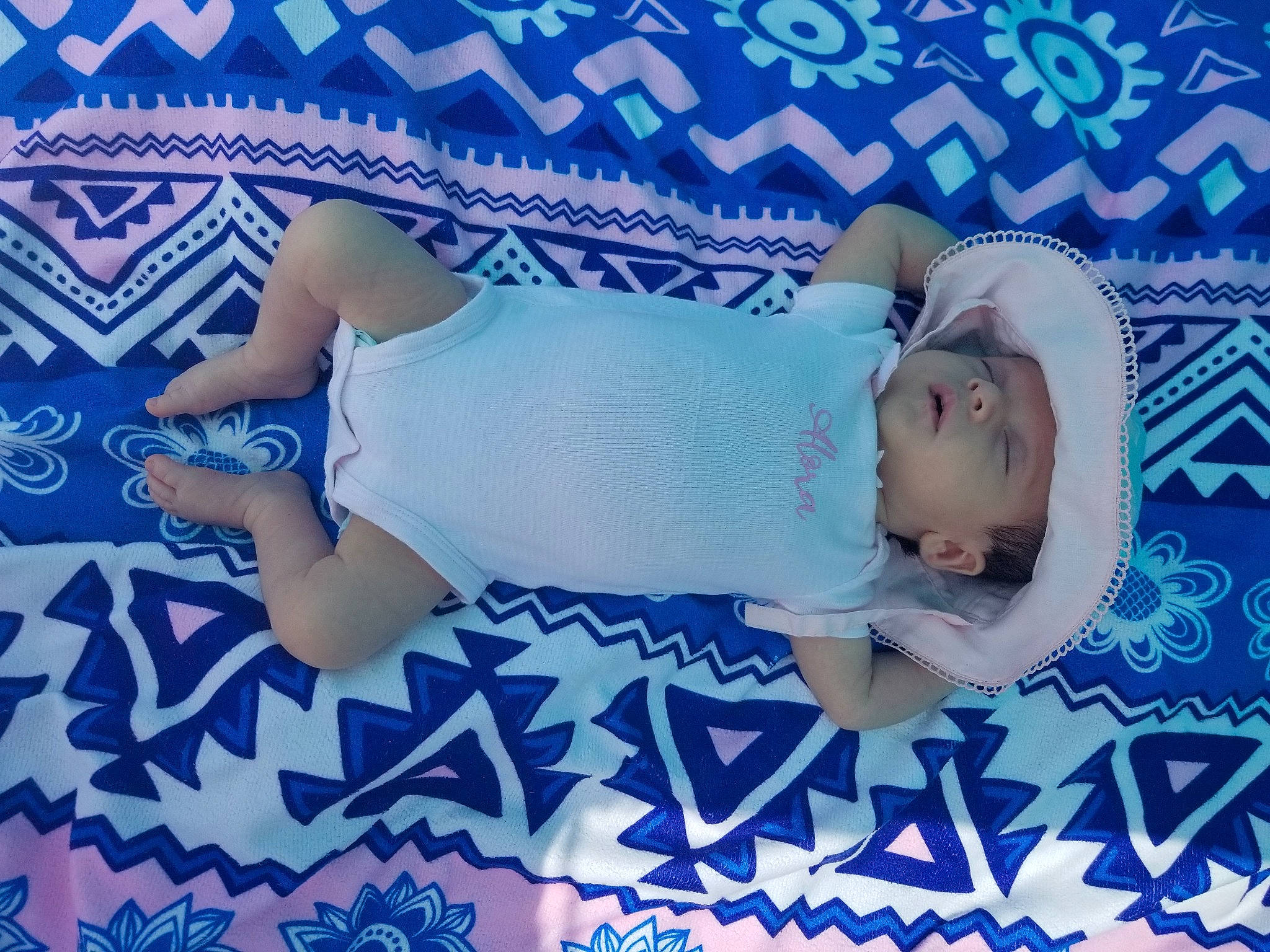 Alora is registered to the contest to win money with this photo: baby, bedtime, blue, child, headwear, nap, person, product, sleep, textile