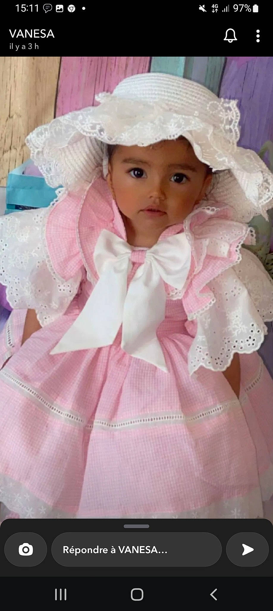 Inaya participe au concours pour gagner de l'argent avec cette photo : baby_toddler_clothing, bridal_accessory, cheek, doll, dress, embellishment, eye, eyelash, face, hairstyle, head, headpiece, headwear, iris, lip, person, pink, skin, sleeve, toy