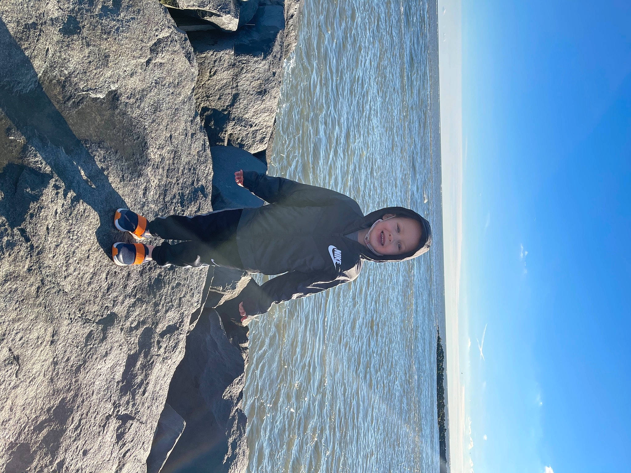 Hayden is registered to the contest to win money with this photo: adventure, azure, bedrock, boat, elbow, electric_blue, extreme_sport, fun, headwear, joy, klippe, lake, leisure, mountain, person, recreation, rock, sky, slope, smile