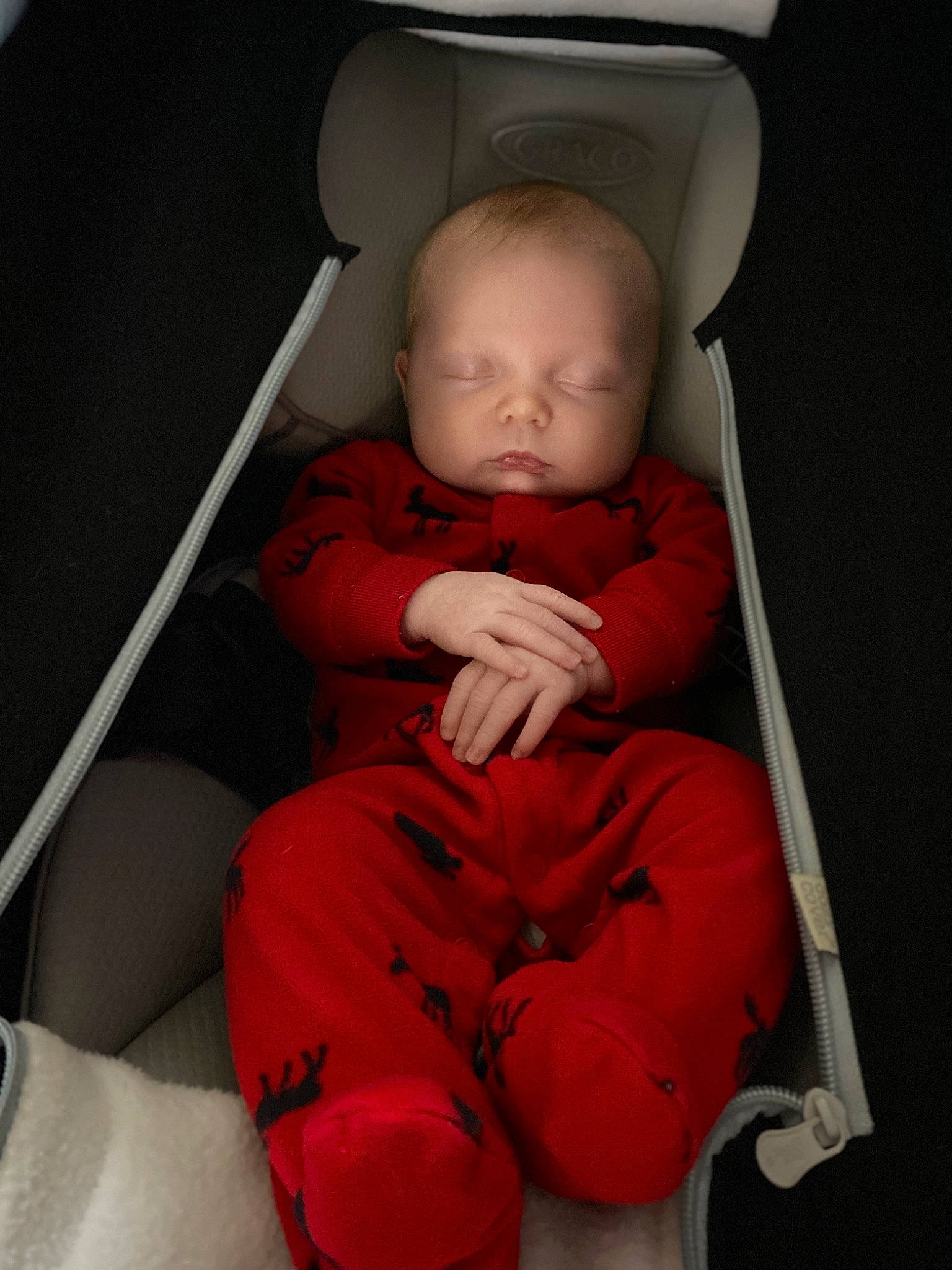 Aurora is registered to the contest to win money with this photo: arm, baby, baby_toddler_clothing, car_seat, cheek, comfort, finger, flooring, foot, hand, human_body, knee, mouth, nose, person, sitting, skin, sleeve, thumb, toddler