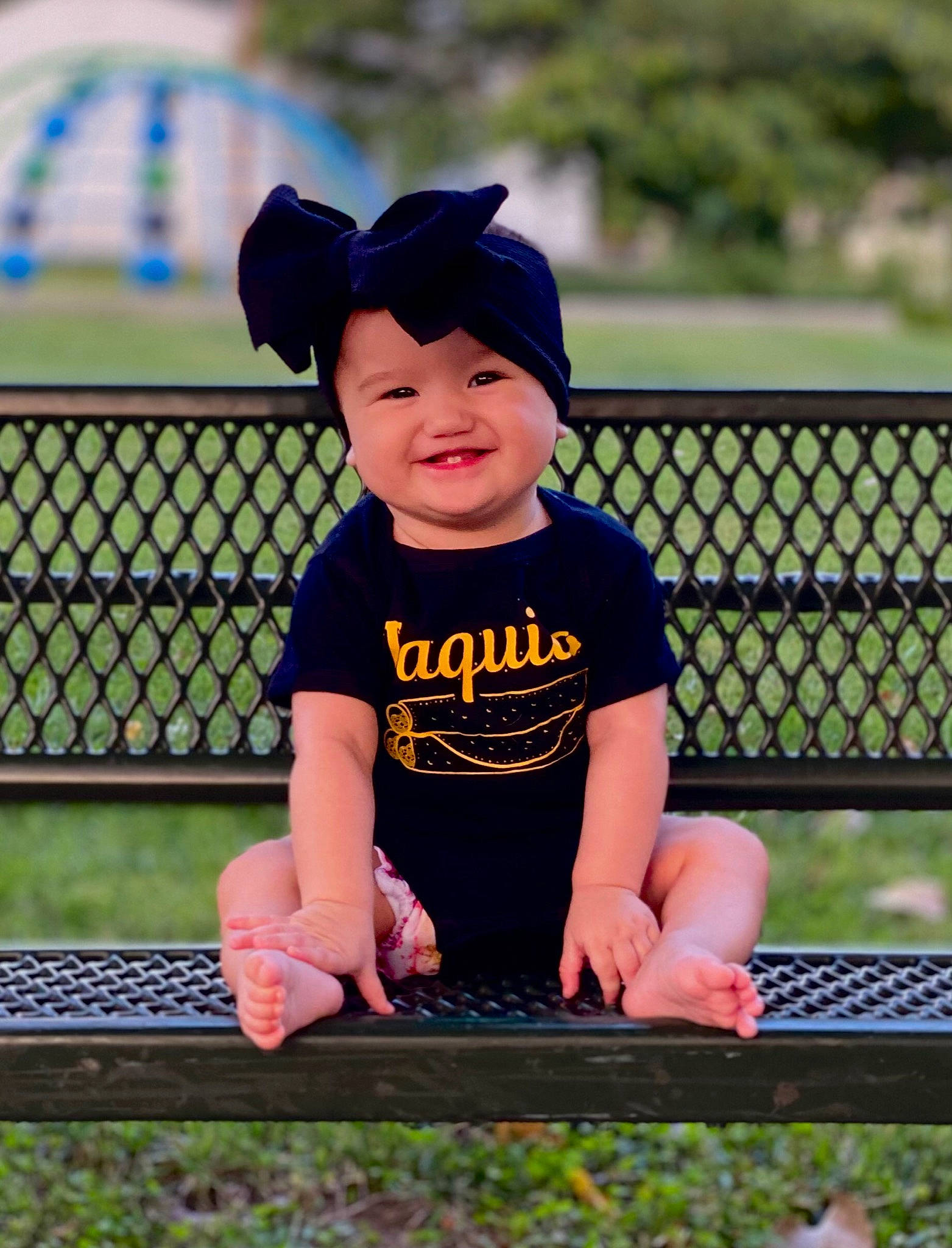 Luciana joined the competition — help win amazing prizes! baby, baby_toddler_clothing, baseball_cap, cap, child, electric_blue, face, fence, fun, grass, happy, hat, headwear, joy, leisure, person, plant, recreation, shorts, sleeve