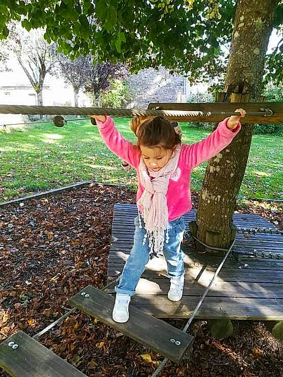 Emma participe au concours pour gagner de l'argent avec cette photo : boot, botany, child, deciduous, fun, grass, happy, leaf, leisure, outerwear, people_in_nature, person, plant, recreation, soil, sunlight, tints_and_shades, toddler, tree, wood