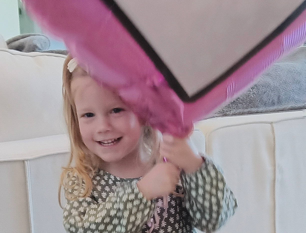 Briana is registered to the contest to win money with this photo: baby, baby_toddler_clothing, child, event, fashion_accessory, fun, happy, joy, laugh, leisure, linens, magenta, party, pattern, person, pink, portrait_photography, purple, room, smile