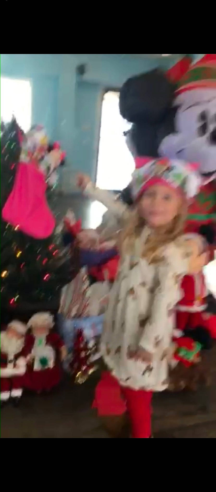 Briana is registered to the contest to win money with this photo: carmine, child, christmas, christmas_decoration, christmas_eve, christmas_ornament, city, costume, crowd, event, festival, fun, fur, happy, headwear, holiday, magenta, person, toddler, tradition