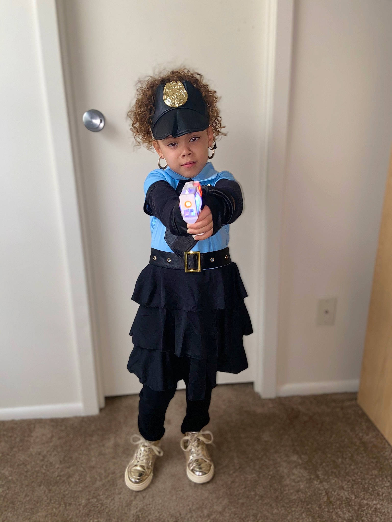 Ivelisse is registered to the contest to win money with this photo: child, clothing, costume, joint, outerwear, person, standing, uniform