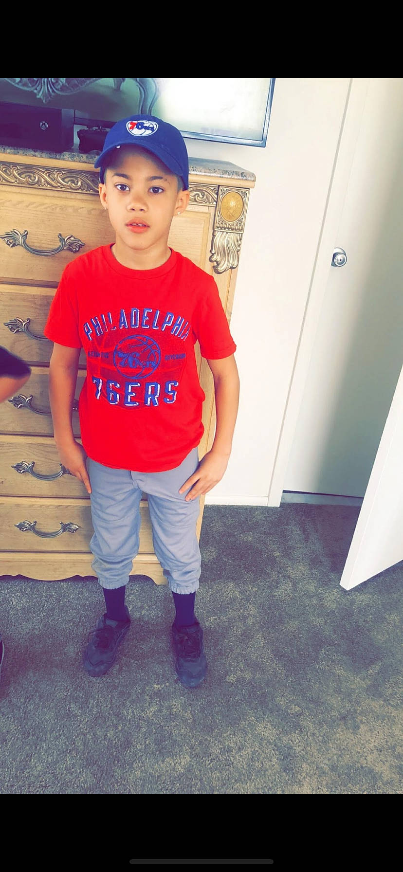 Ismael is registered to the contest to win money with this photo: child, child_model, cool, footwear, jeans, person, pink, shoe, smile, standing, t_shirt, top