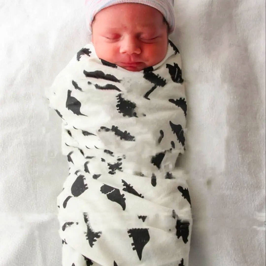 Jaxon joined the competition — help win amazing prizes! baby, baby_toddler_clothing, beanie, cap, child, face, fashion_design, fur, headwear, military_camouflage, monochrome_photography, nail, outerwear, pattern, person, sitting, skin, sleeve, textile, toddler