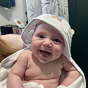 Hunter joined the competition — help win amazing prizes! baby, smiling, towel, hooded_towel, bathroom, happy, child, skin, cute, infant, person, face, portrait, chubby, newborn, wrapped, white, soft, indoors, expression