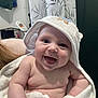 baby, smiling, towel, hooded_towel, bathroom, happy, child, skin, cute, infant, person, face, portrait, chubby, newborn, wrapped, white, soft, indoors, expression