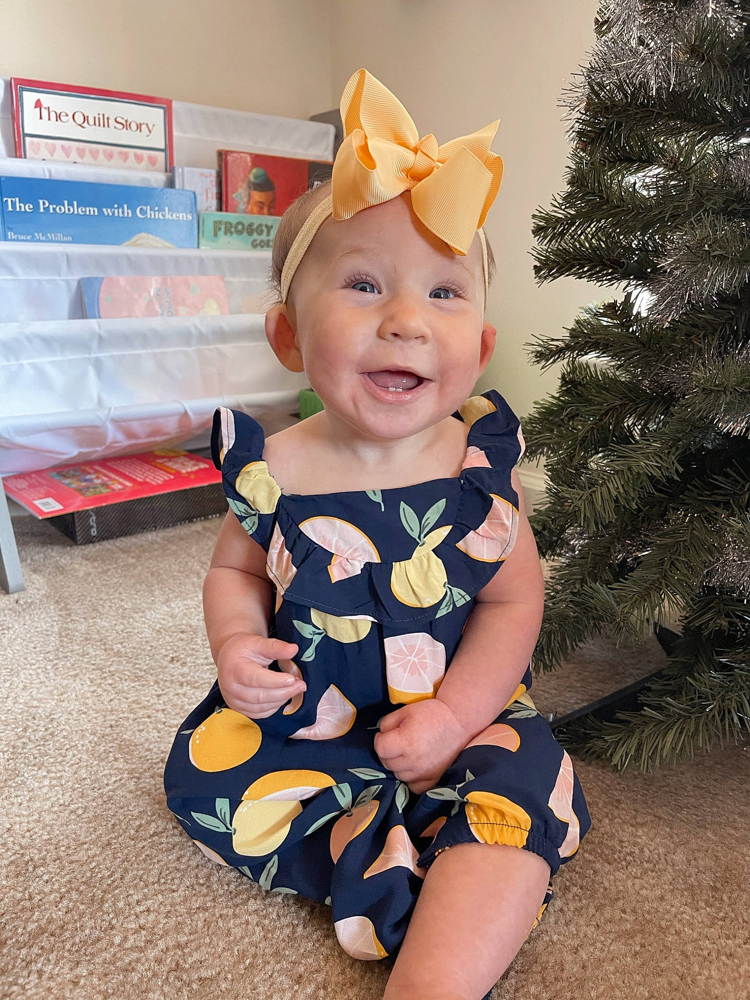 Clementine joined the competition — help win amazing prizes! baby, baby_toddler_clothing, child, christmas_tree, conifer, costume_hat, eye, fun, happy, hat, headwear, human_leg, party_supply, pattern, person, sitting, sleeve, smile, standing, t_shirt