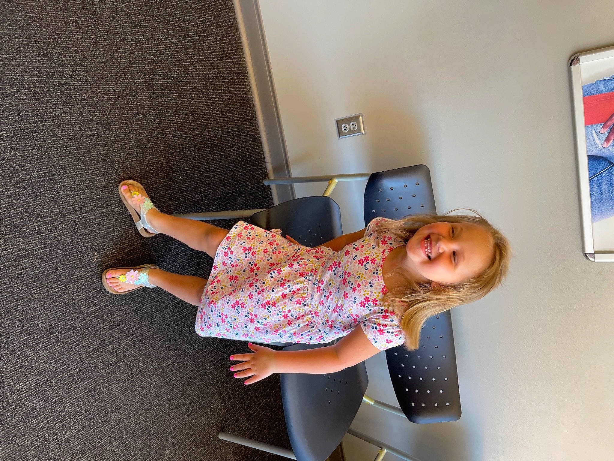 Eleanor is registered to the contest to win money with this photo: baby_toddler_clothing, child, comfort, floor, flooring, fun, happy, human_leg, joy, knee, leg, leisure, person, picture_frame, room, sandal, smile, sock, t_shirt, thigh