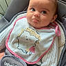 Malya a rejoint le concours — aidez-le/la à gagner de superbes lots ! baby, infant, child, bib, sweater, car_seat, baby_seat, clothing, cute, face, expression, indoor, child_seat, seatbelt, pink, white, gray, person, portrait, young