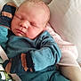 Bryson is registered to the contest to win money with this photo: baby, blanket, child, closeup, comfort, cozy, cute, face, hands, indoor, infant, mittens, newborn, pajamas, person, portrait, resting, sleeping, soft, toddler
