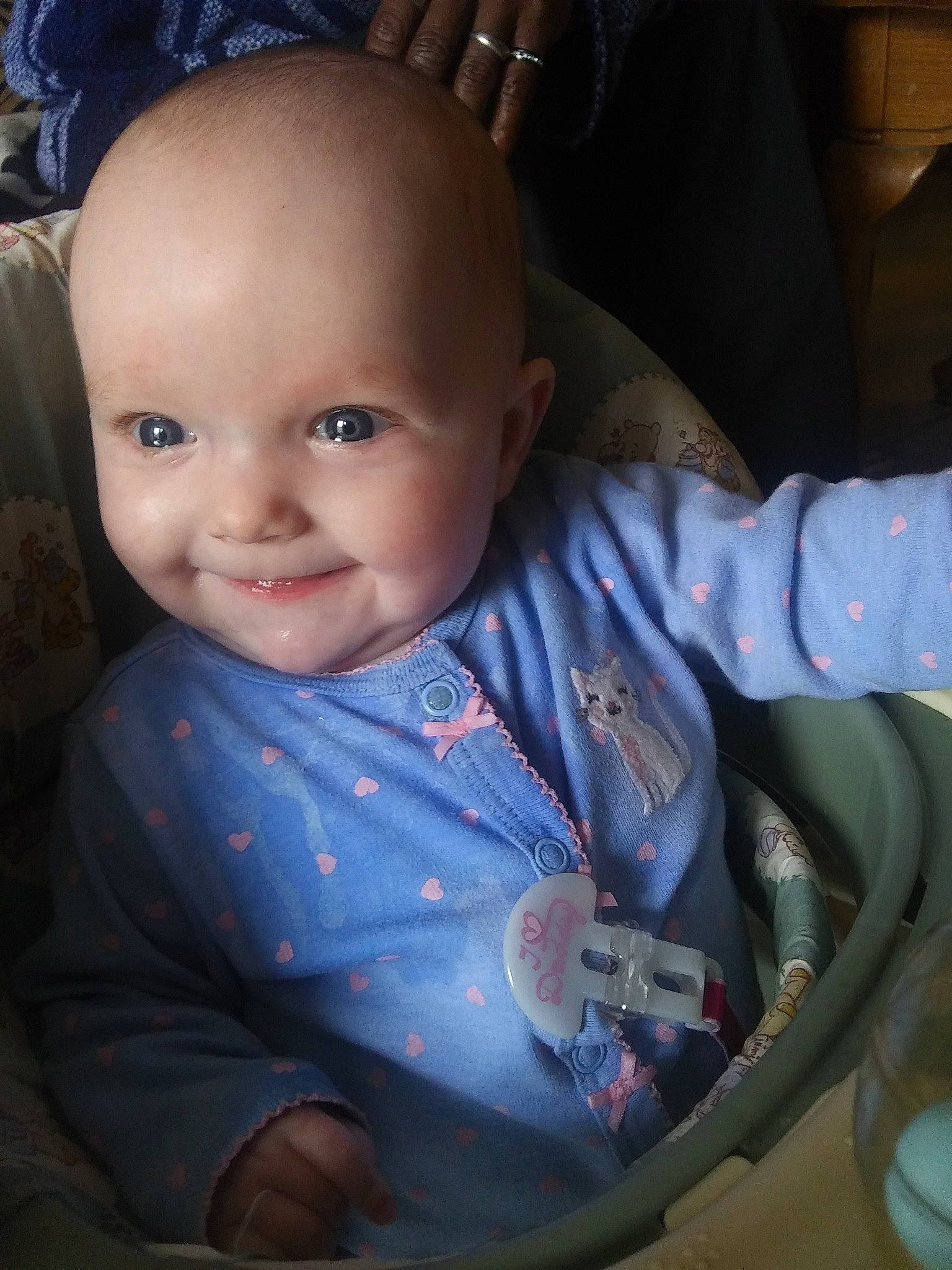 Meghan is registered to the contest to win money with this photo: baby, cheek, child, chin, ear, eye, face, facial_expression, forehead, head, iris, joy, lip, mouth, nose, person, product, sitting, skin, smile