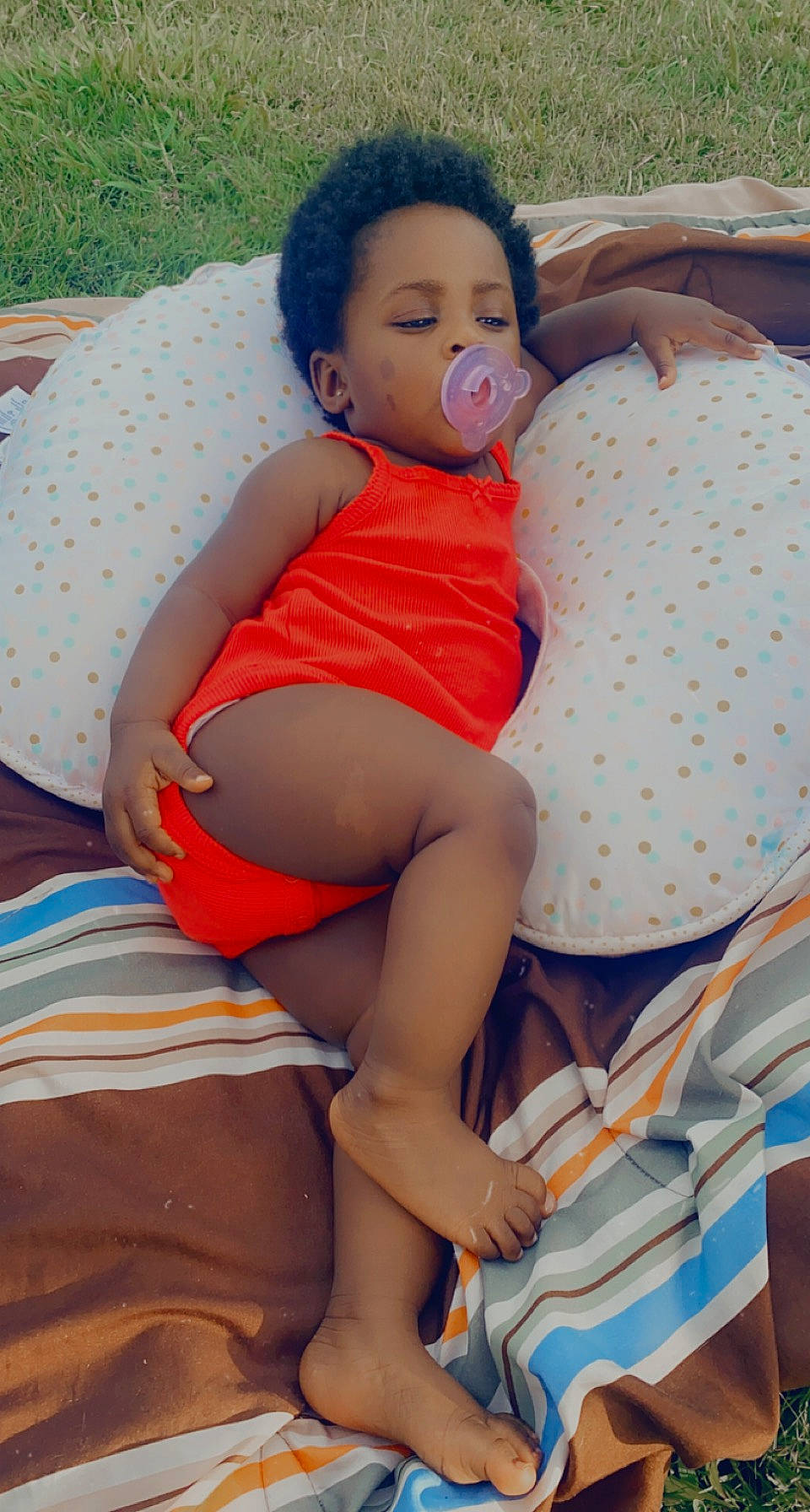 Cambree is registered to the contest to win money with this photo: baby_toddler_clothing, comfort, eye, face, facial_expression, glasses, hairstyle, hand, happy, head, human, human_body, joint, leg, mouth, neck, orange, person, shorts, skin