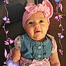 Melesia joined the competition — help win amazing prizes! baby, child, pink_bow, headband, floral_dress, denim_top, couch, smiling, cute, portrait, infant, sitting, indoors, heart_frame, decorative_frame, happy, young_child, pink, purple, clothing