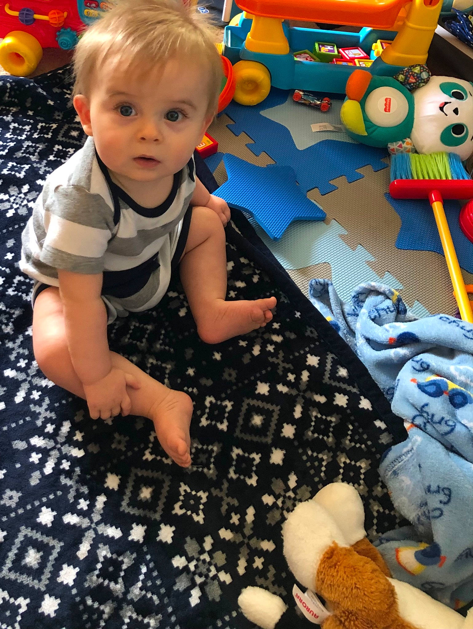 Brayden joined the competition — help win amazing prizes! baby, baby_playing_with_toys, baby_toddler_clothing, blue, child, flooring, fun, happy, leisure, pattern, person, photograph, play, product, room, sitting, snapshot, toddler, toy, toy_vehicle