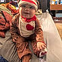 Paxton joined the competition — help win amazing prizes! baby, bed, casual, child, clothing, costume, cute, fabric, face, footwear, hand, happy, home, indoor, person, plush, red_bow, smiling, sock_monkey, toy