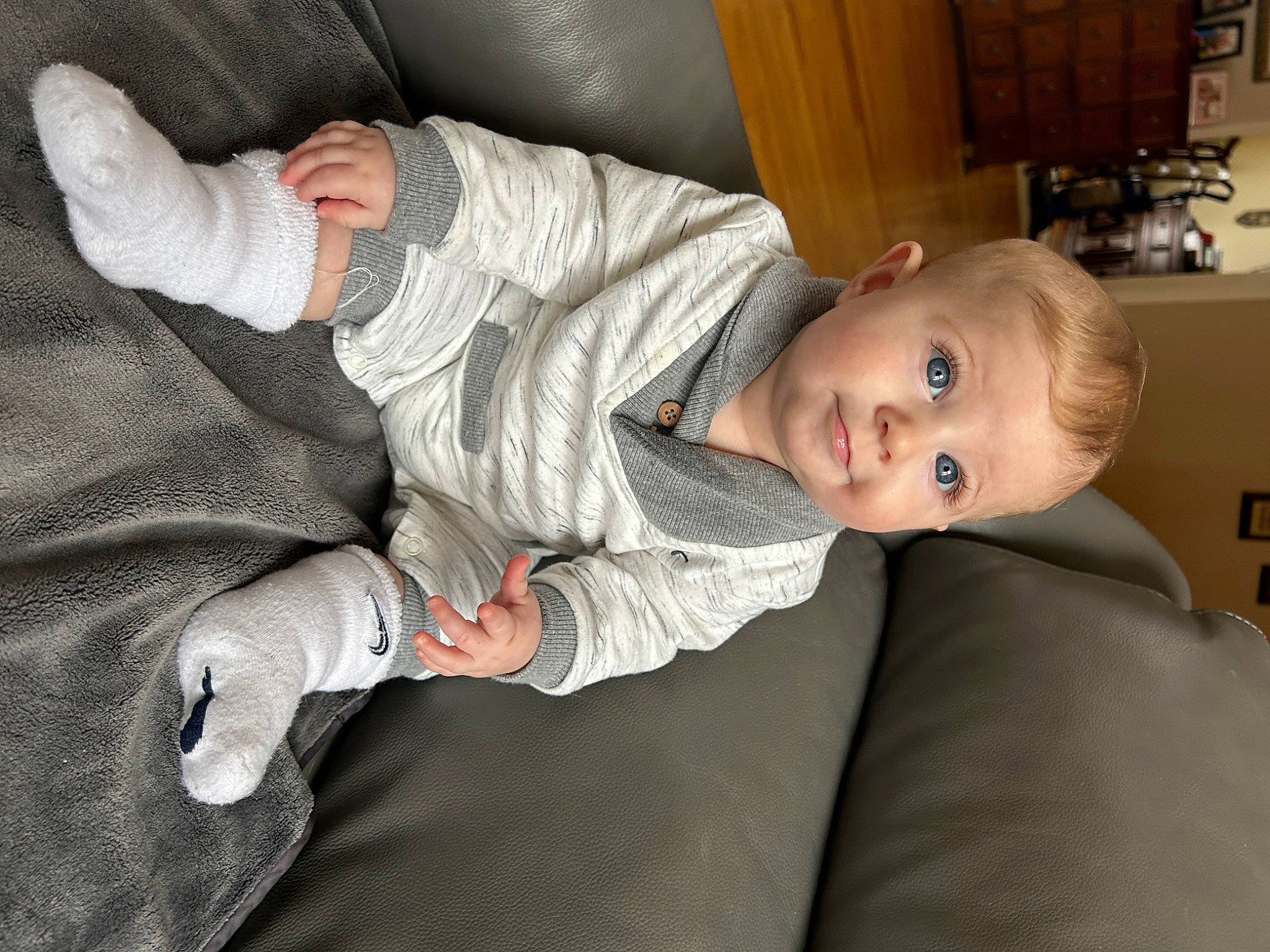 Alan joined the competition — help win amazing prizes! baby, baby_toddler_clothing, cabinetry, child, comfort, eye, foot, gesture, head, human_leg, knee, lap, linens, person, shelf, sitting, sleeve, suit, thumb, toddler
