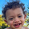 toddler, child, baby, portrait, close_up, smiling, laughing, curly_hair, brown_hair, face, teeth, eyes, outdoor, sunlight, blue_sky, trees, nature, happy, joyful, photography