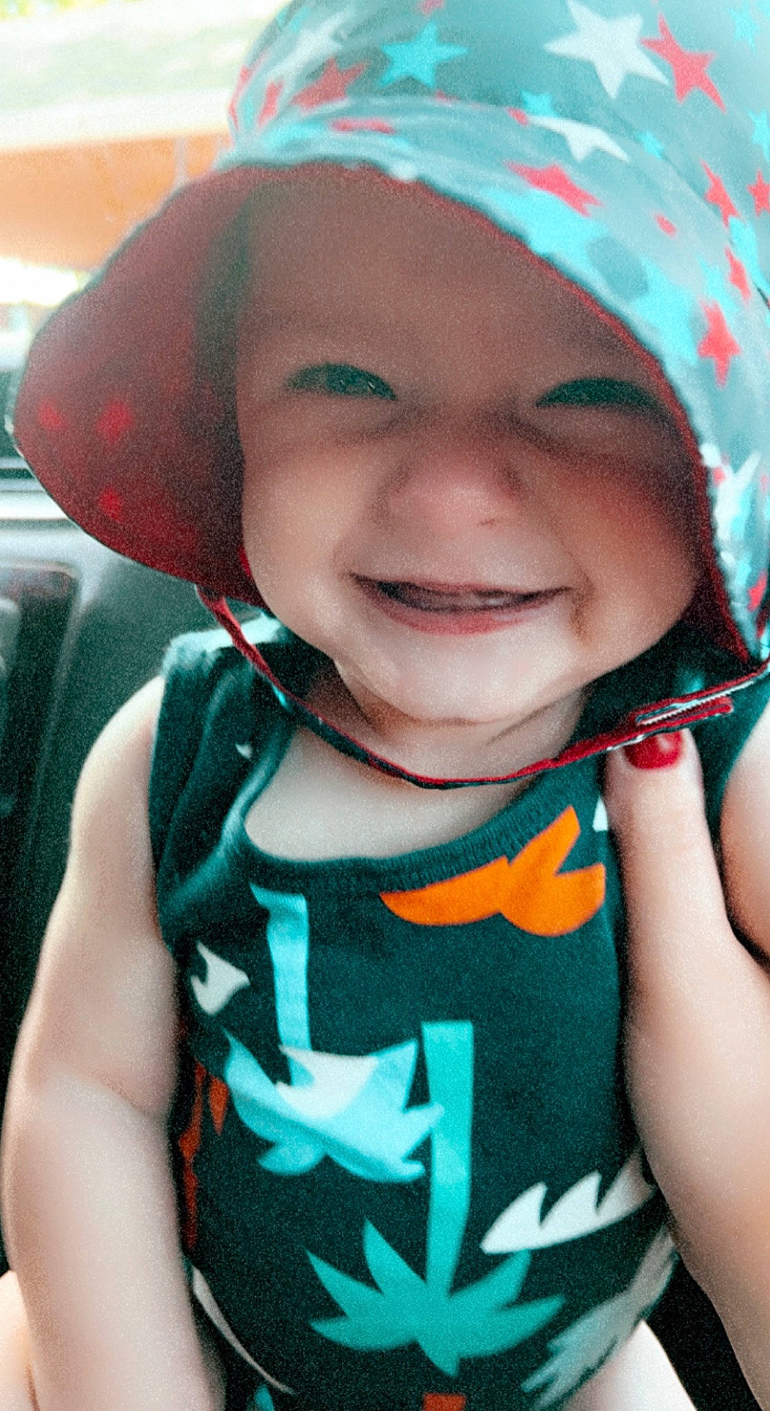 Creed is registered to the contest to win money with this photo: azure, baby, baby_toddler_clothing, cheek, chin, dress, eye, eyebrow, face, facial_expression, happy, head, headwear, human_body, iris, joy, lip, mouth, neck, nose