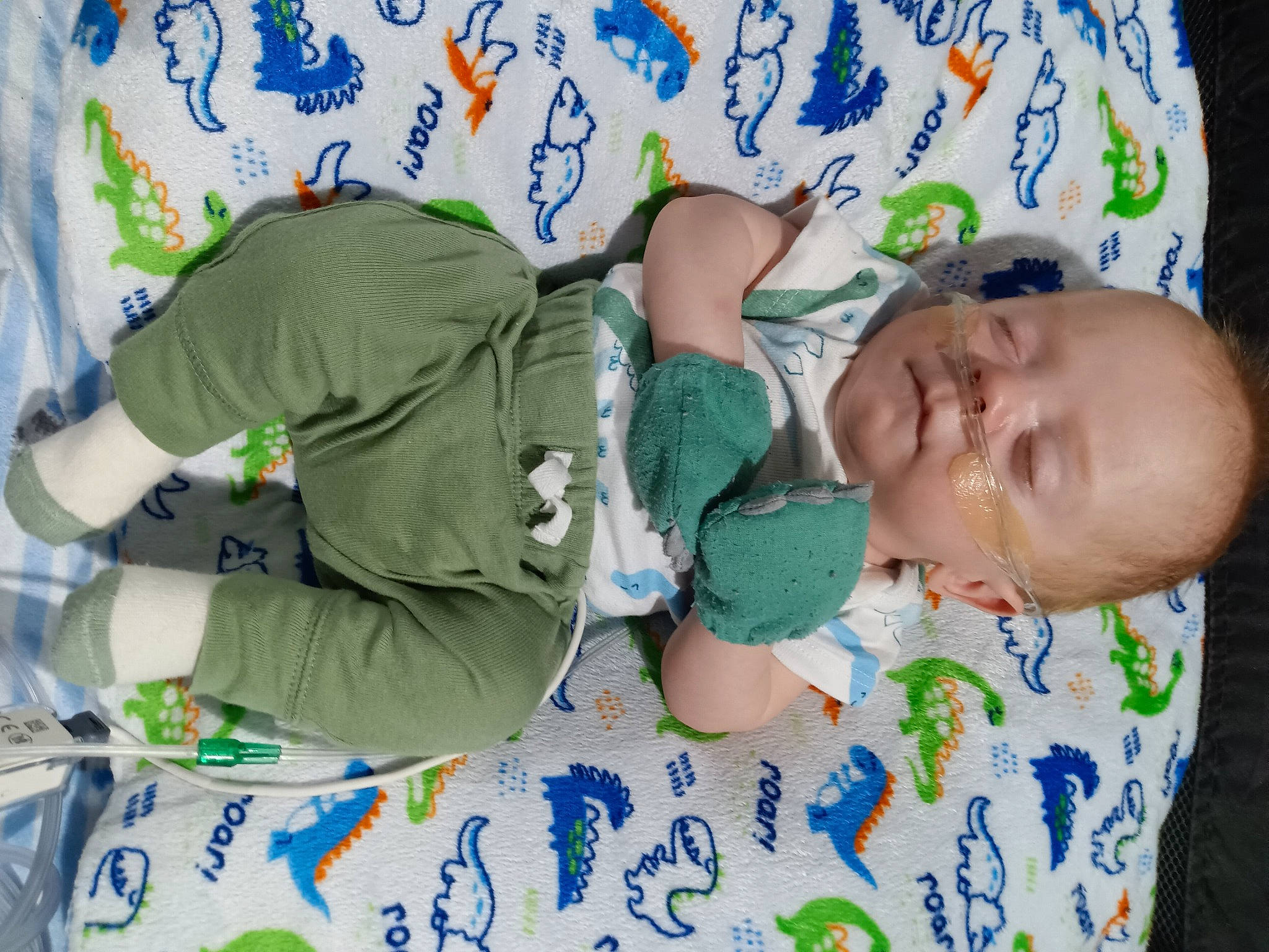 Aryan is registered to the contest to win money with this photo: adaptation, arm, baby, baby_products, baby_toddler_clothing, bedtime, child, comfort, happy, linens, mammal, nap, pattern, people, person, room, sleeve, sock, t_shirt, textile