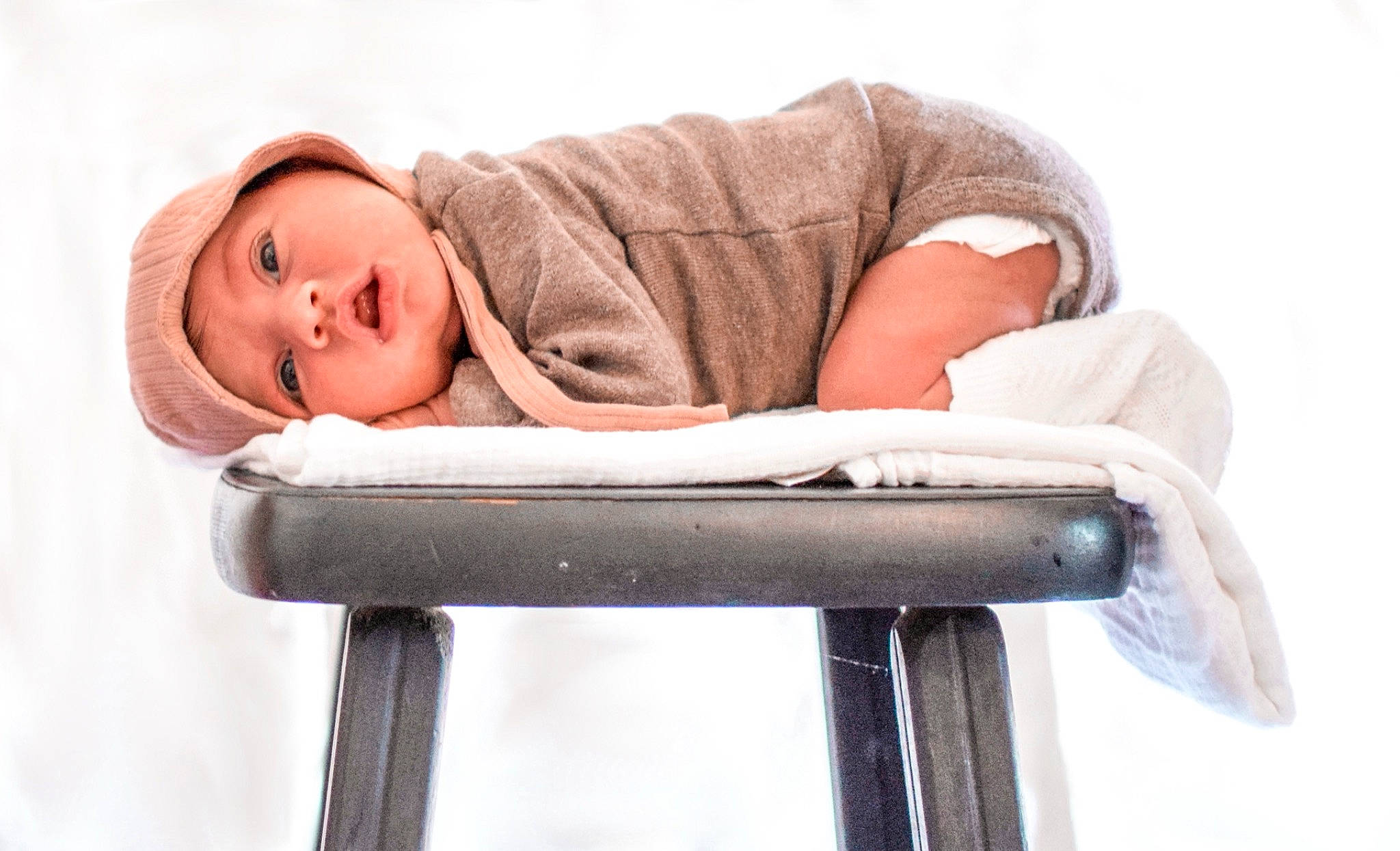 Aya is registered to the contest to win money with this photo: baby, baby_products, chair, child, comfort, furniture, headwear, person, product, sitting, toddler