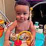 baby, child, activity_center, toy, indoor, curious, hands, face, play, colorful, furniture, television, room, carpet, expression, person, young_child, infant, entertainment, cute