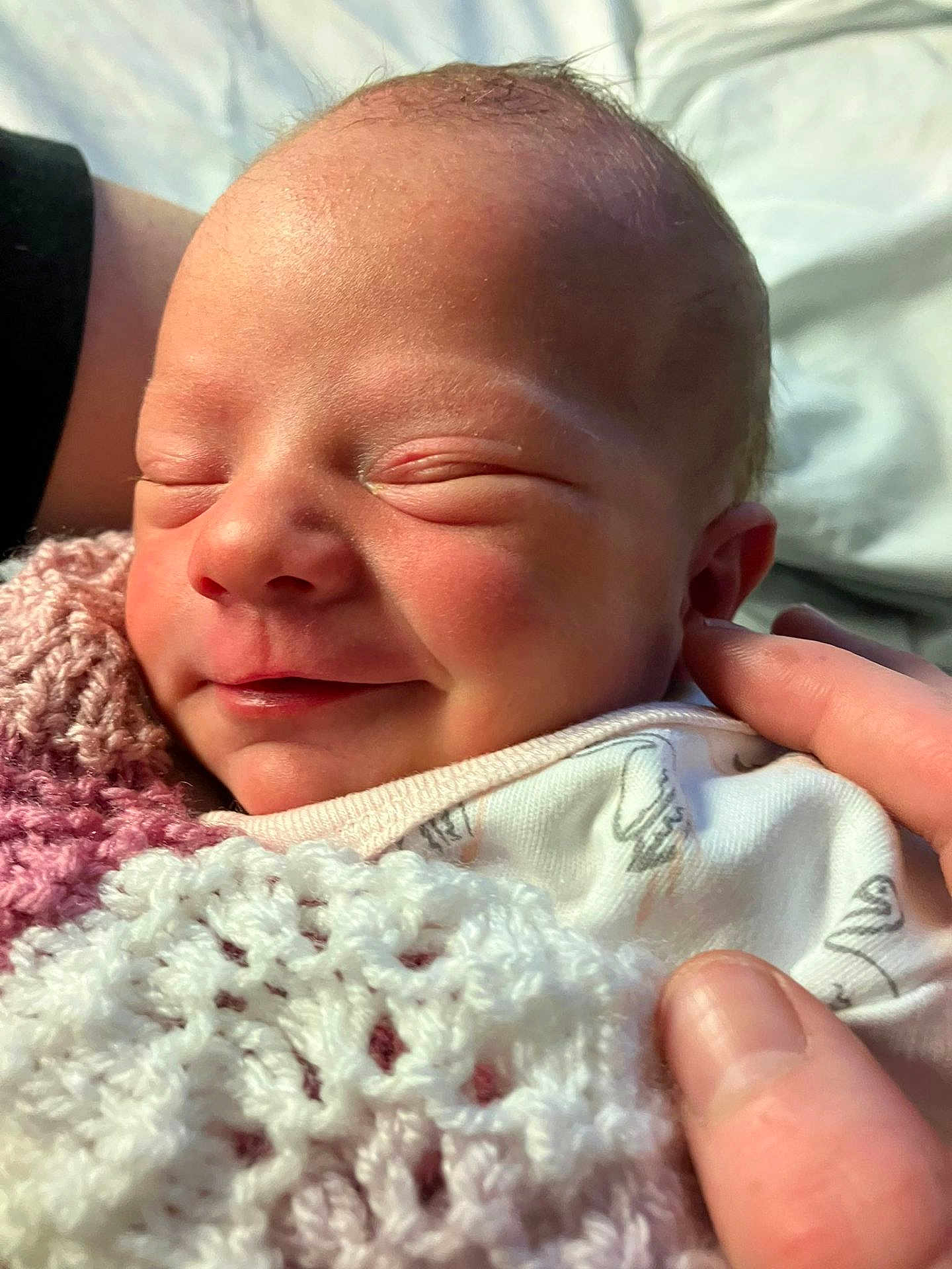 Emilee joined the competition — help win amazing prizes! newborn, baby, sleeping, smiling, face, hand, blanket, knitted, cozy, soft_light, closeup, infant, peaceful, skin, portrait, cute, child, resting, tender, love
