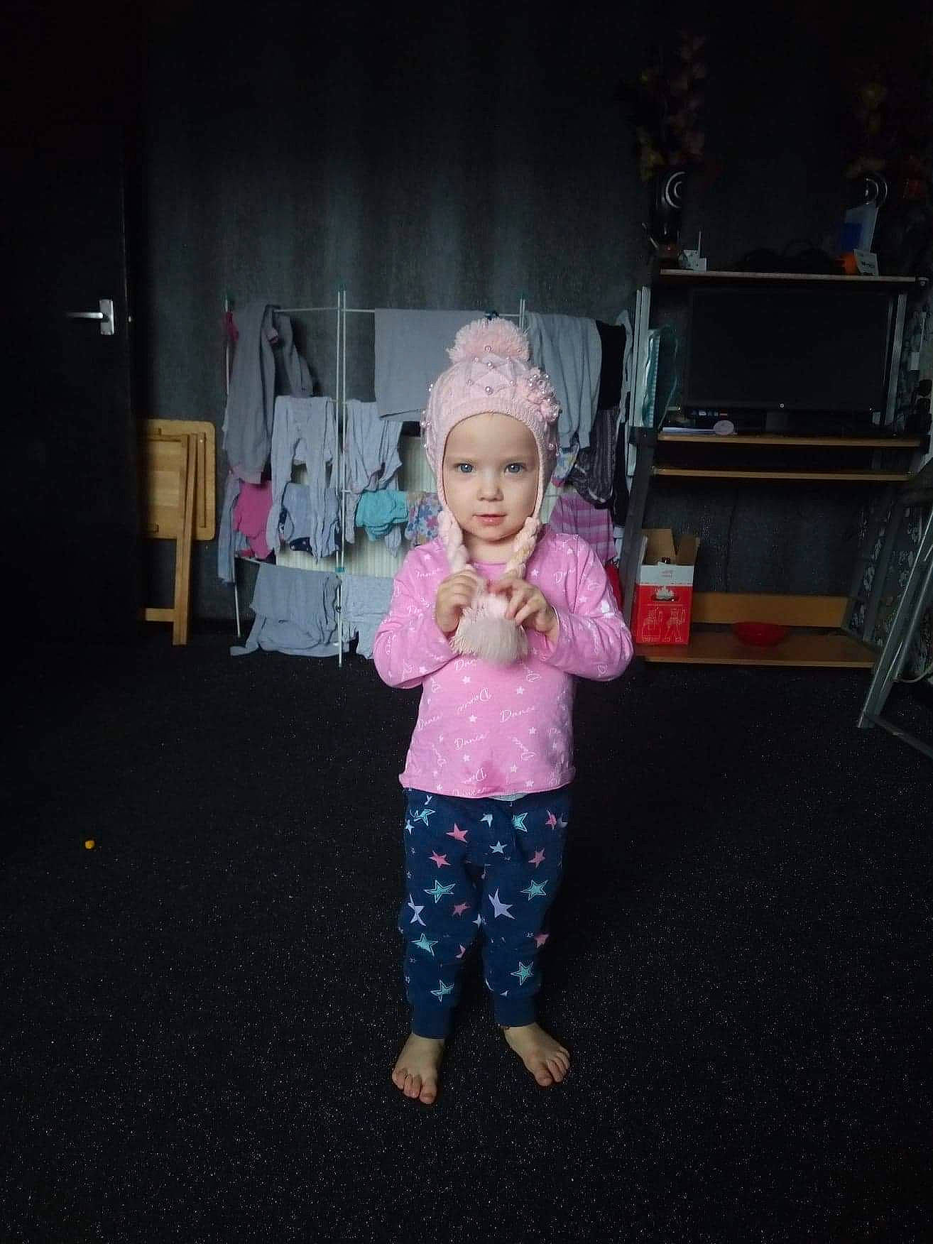 Alecia is registered to the contest to win money with this photo: child, fun, head, night, person, pink, smile, standing, toddler, vacation