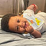 Jayceon is registered to the contest to win money with this photo: architecture, baby, babylaughing, bed, bedroom, building, cushion, face, furniture, happy, head, homedecor, hospital, indoors, newborn, person, photography, portrait, room, smile