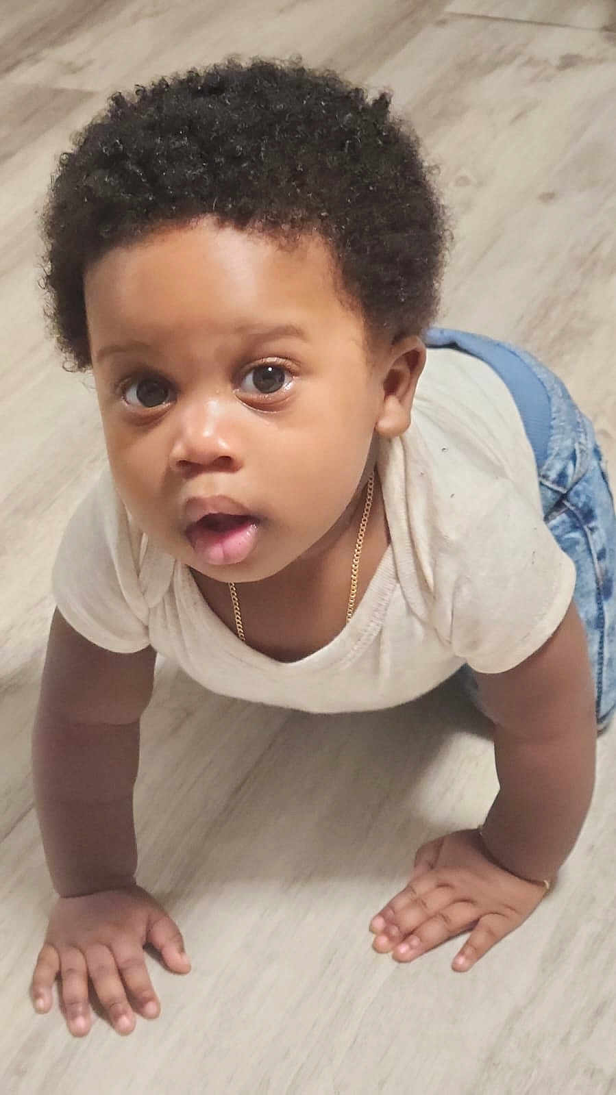 Jayceon is registered to the contest to win money with this photo: baby, babycrawling, crawling, face, head, person