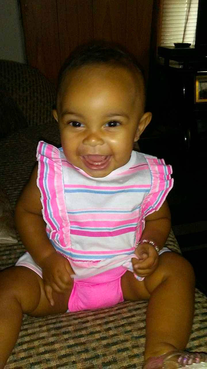 Tatiana is registered to the contest to win money with this photo: abdomen, baby, cheek, chest, child, chin, face, finger, forehead, fun, head, joy, lip, mouth, neck, nose, person, pink, sitting, skin