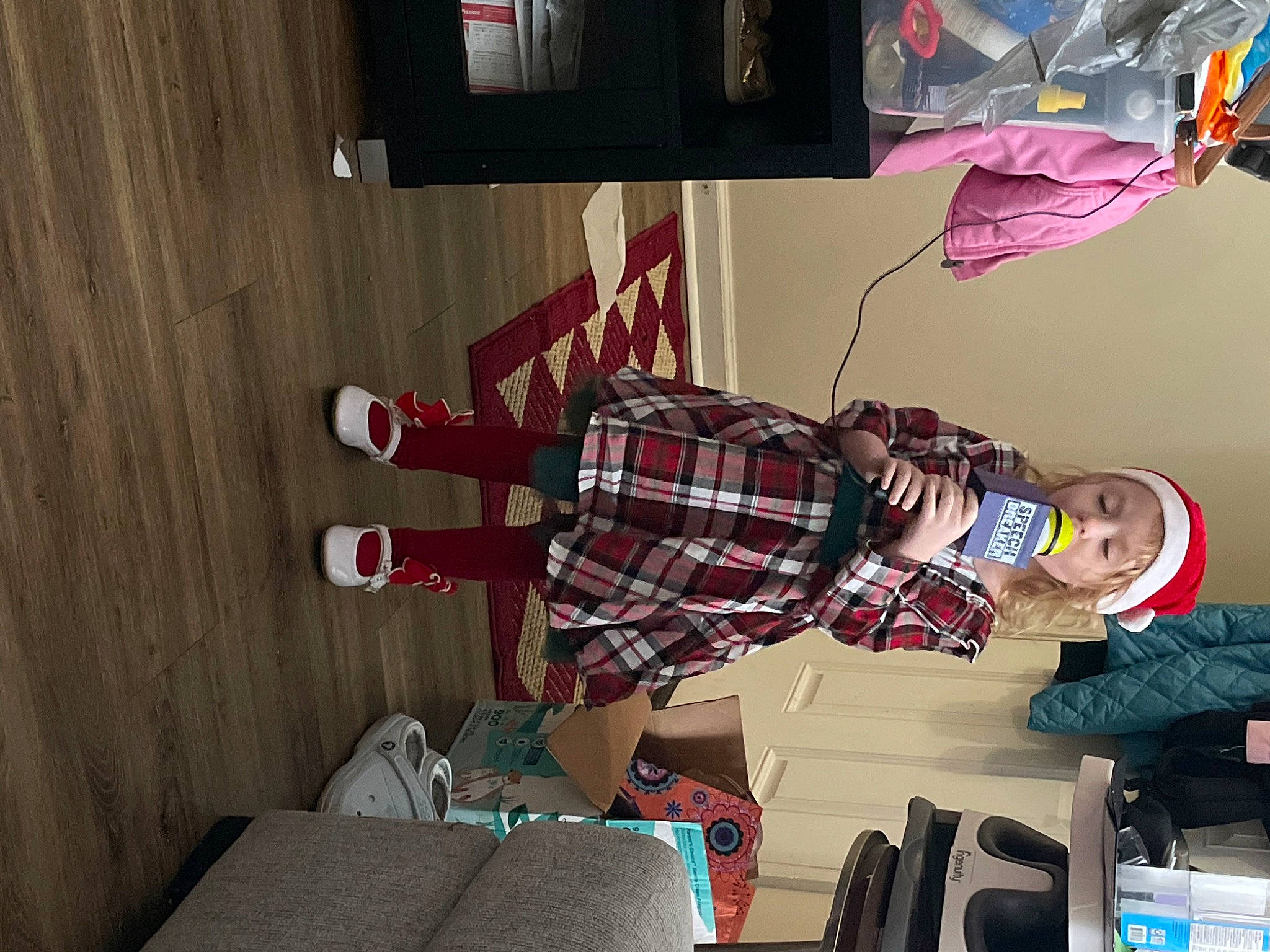 Carmen is registered to the contest to win money with this photo: carmine, comfort, dress, flooring, fun, hardwood, human_leg, magenta, pattern, person, plaid, room, shorts, sock, tartan, textile, thigh, tree, visual_arts, walking_shoe
