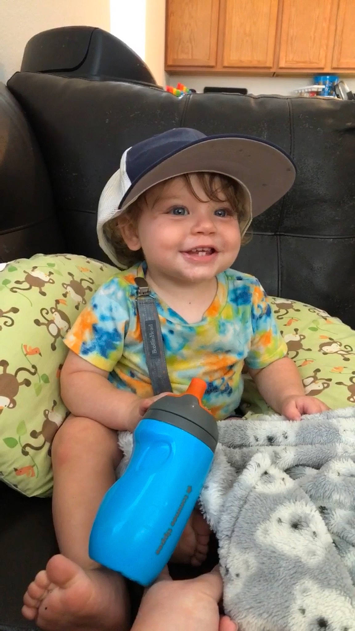 Jaxtyn is registered to the contest to win money with this photo: baby, baby_laughing, baby_playing_with_toys, baby_toddler_clothing, blue, cap, child, comfort, electric_blue, eye, fun, happy, hat, headwear, human_body, joy, person, plastic_bottle, product, skin