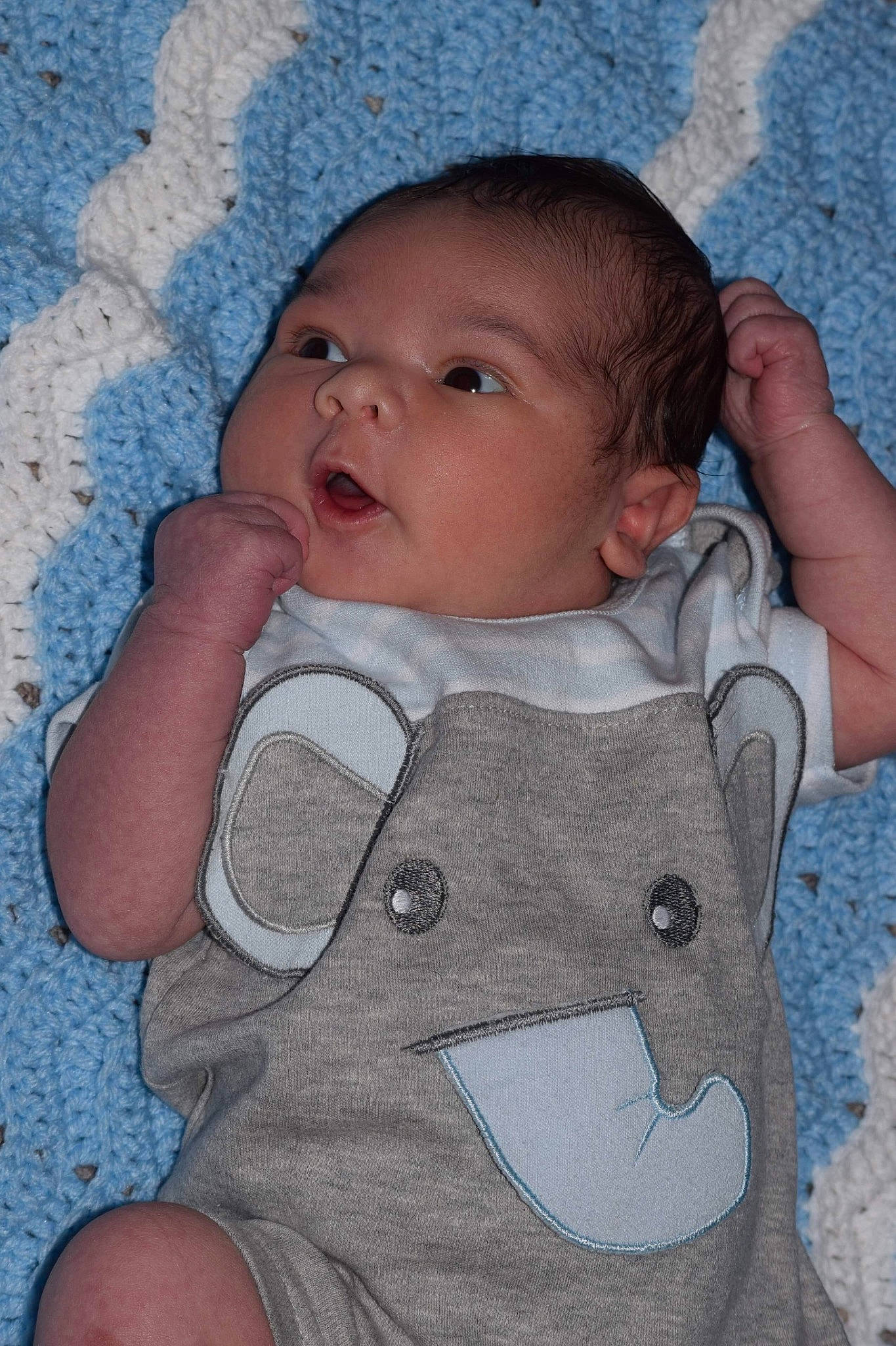 Isaak is registered to the contest to win money with this photo: blue, boy, cheek, child, eye, face, finger, hand, head, human, infant, mouth, nose, organ, person, product, skin, smile, textile, toddler