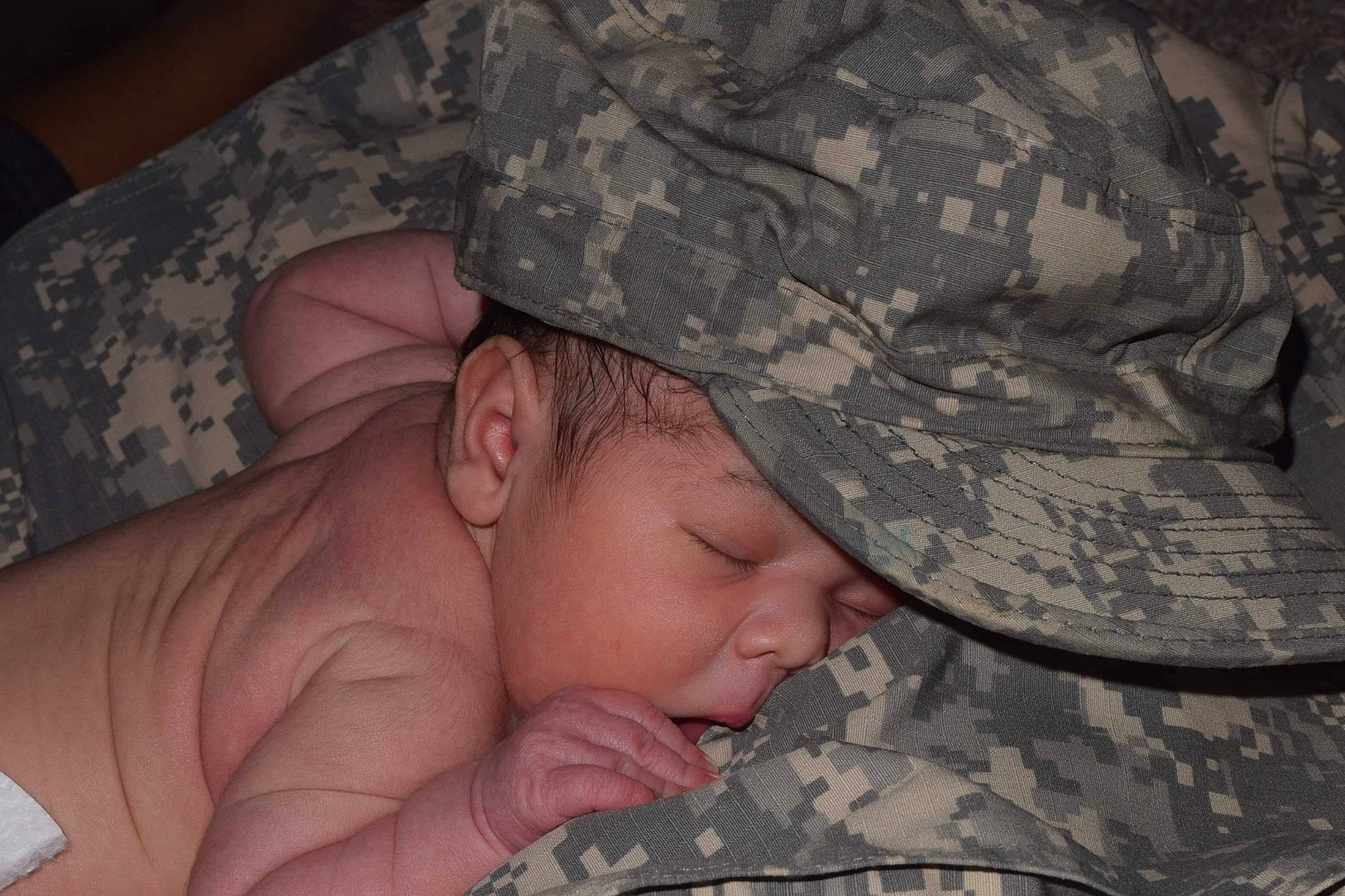 Isaak joined the competition — help win amazing prizes! child, finger, infant, military, military_camouflage, mouth, person, sleep, soldier