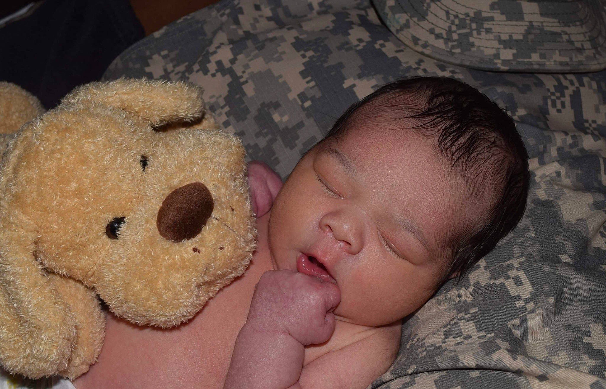 Isaak is registered to the contest to win money with this photo: bedtime, cheek, child, ear, head, infant, mouth, nap, nose, person, product, skin, sleep, snout, stuffed_toy, teddy_bear, toddler, toy