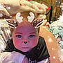 baby, child, face, reindeer_filter, antlers, ears, nose, snowflakes, blanket, indoor, wood_paneling, cute, winter_theme, digital_filter, infant, clothing, black_shirt, white_sleeves, portrait, holiday