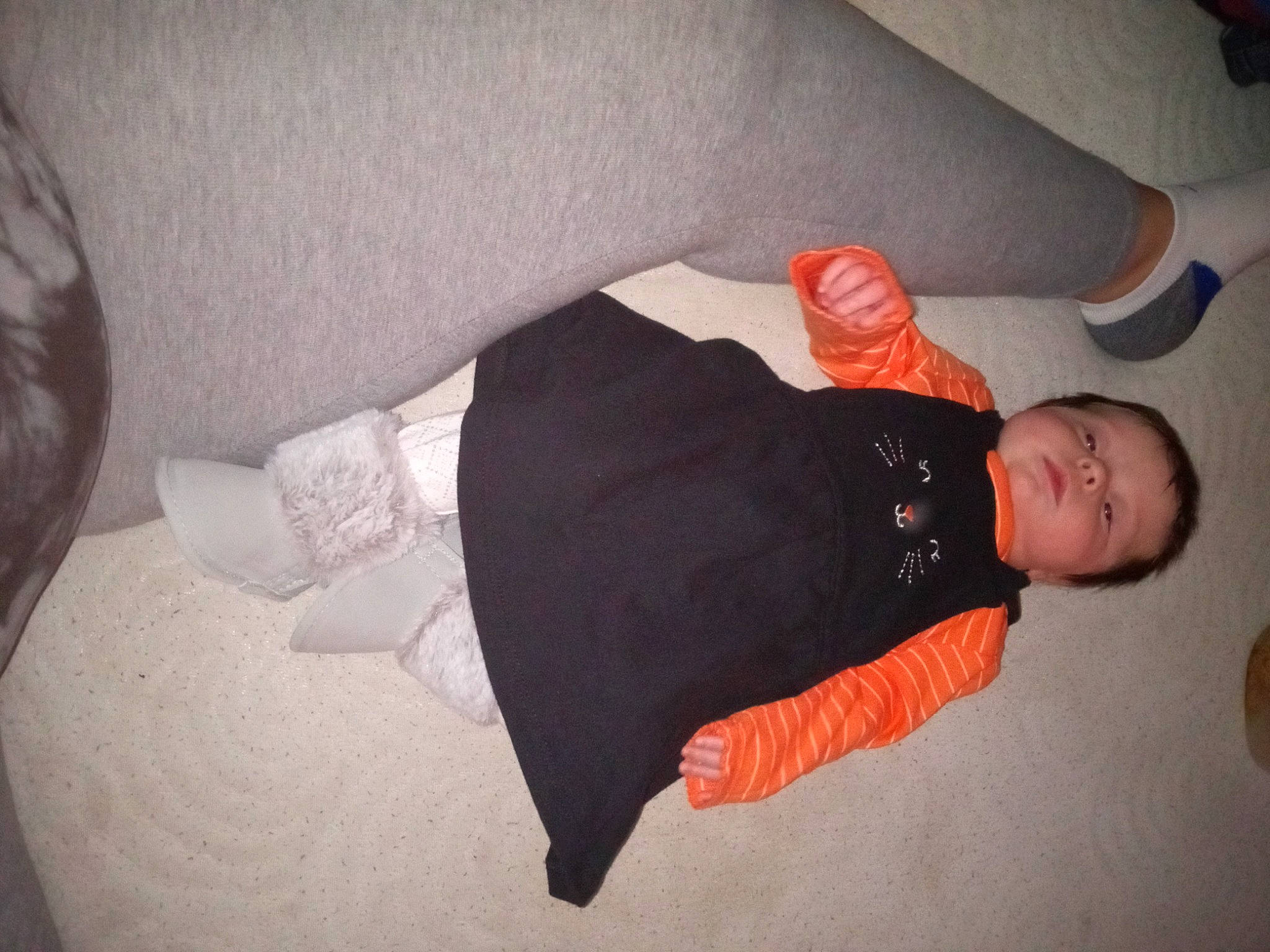 Peyton is registered to the contest to win money with this photo: arm, baby, baby_toddler_clothing, comfort, elbow, finger, flooring, hand, human_body, human_leg, knee, linens, mouth, person, sleeve, textile, thigh, thumb, toddler, trunk